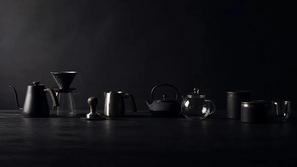 Brewing tools laid out on a dark bench