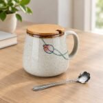 Ceramic Mug with Lid and Spoon, at rest Ceramic Mug with Lid and Spoon